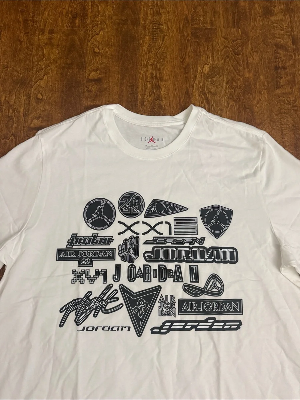Jordan White Short-Sleeve Tee with Navy Logo Collage